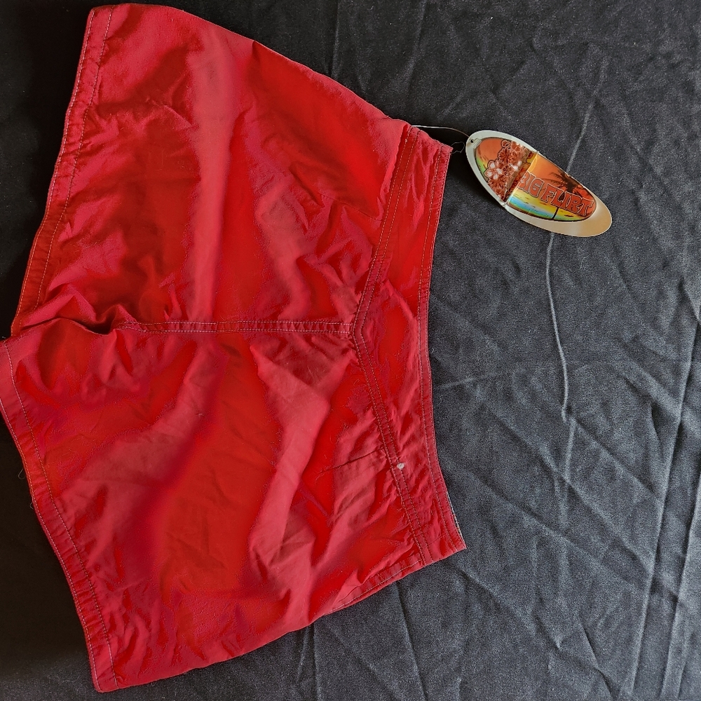 NWT-womens reversible board shorts. Size 9. Red 1 side, blue & red on other side